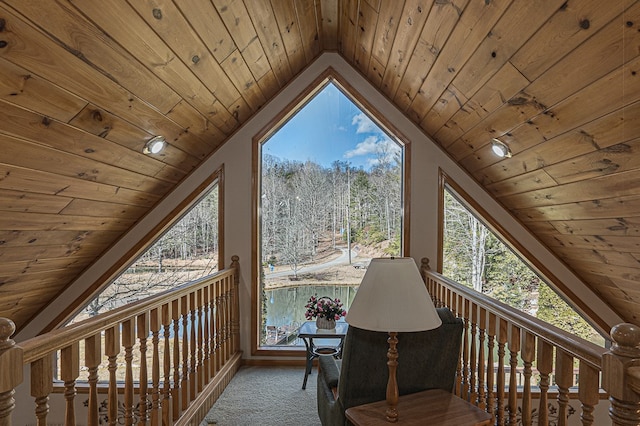 sitting room with lofted ceiling, wood ceiling, and carpet