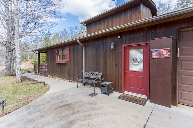 doorway to property featuring a patio