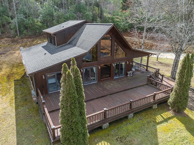 exterior space with a wooden deck and a yard