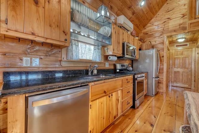 271 Kates Cove Rd, Murphy, NC 28906 - kitchen with stainless steel appliances, wood walls, vaulted ceiling, light wood-type flooring, and wooden ceiling