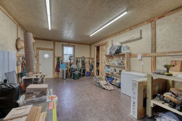 271 Kates Cove Rd, Murphy, NC 28906 - basement with a textured ceiling and fridge