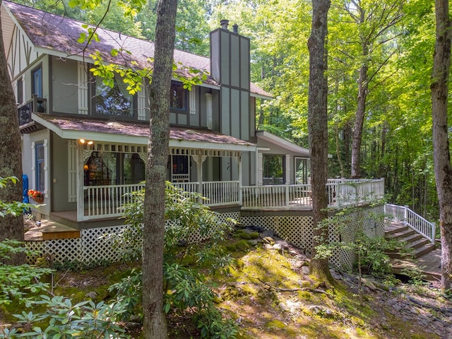 1504 Red Marble Rd, Andrews, NC 28901 - rear view of house featuring a chimney, stucco siding, and stairs