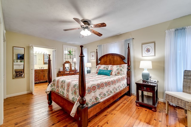 1504 Red Marble Rd, Andrews, NC 28901 - bedroom with light wood-type flooring, a ceiling fan, and ensuite bath