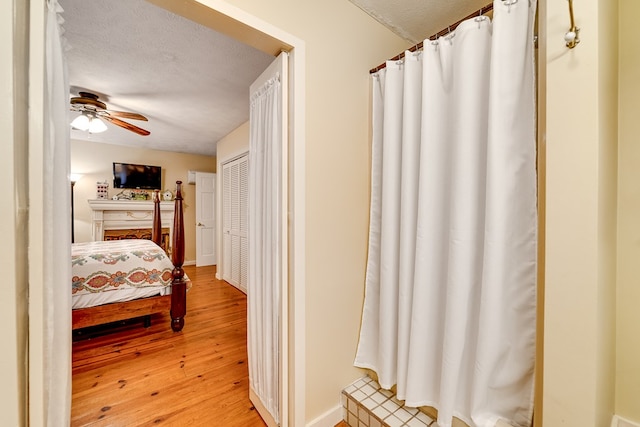 1504 Red Marble Rd, Andrews, NC 28901 - bedroom featuring light wood-type flooring, a textured ceiling, and a ceiling fan