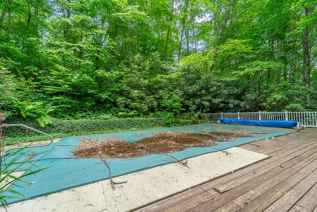 1504 Red Marble Rd, Andrews, NC 28901 - view of swimming pool featuring a wooden deck and a forest view