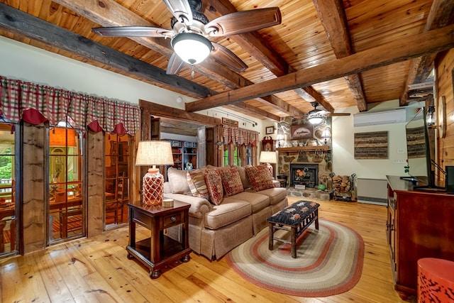 1504 Red Marble Rd, Andrews, NC 28901 - living room with a wooden ceiling with exposed beams, hardwood / wood-style floors, ceiling fan, and a stone fireplace