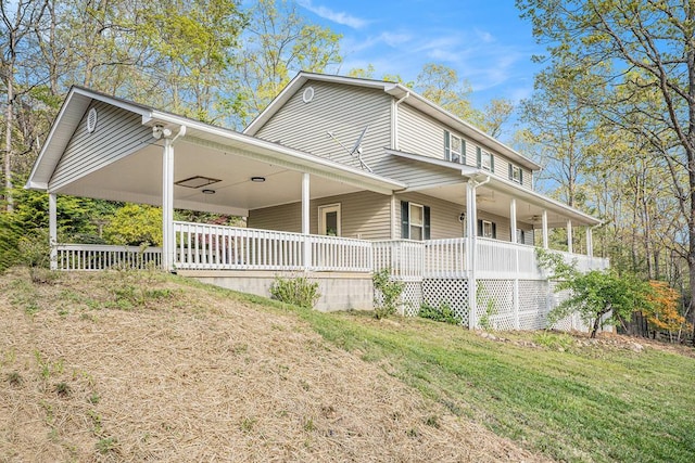 542 Sharp Top Cir, Blairsville, GA 30512 - view of side of property featuring a lawn, an attached carport, and covered porch