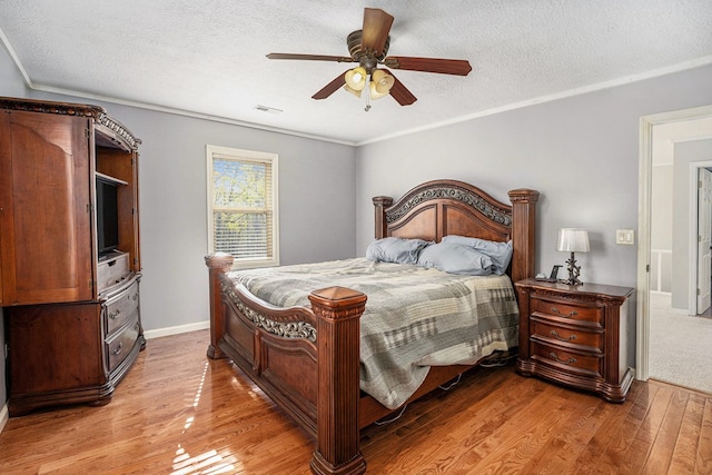 542 Sharp Top Cir, Blairsville, GA 30512 - bedroom featuring wood finished floors, visible vents, a ceiling fan, baseboards, and a textured ceiling