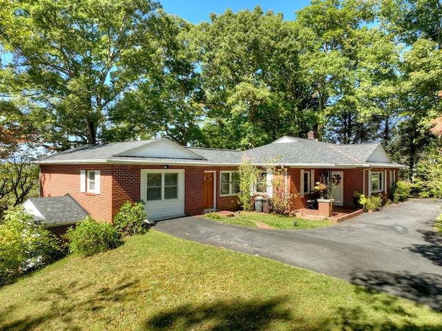 ranch-style home with covered porch and a front lawn