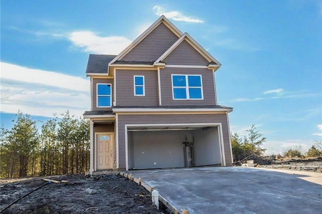 view of front of home with driveway and an attached garage
