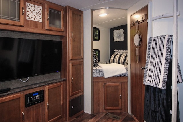 interior space with dark hardwood / wood-style floors