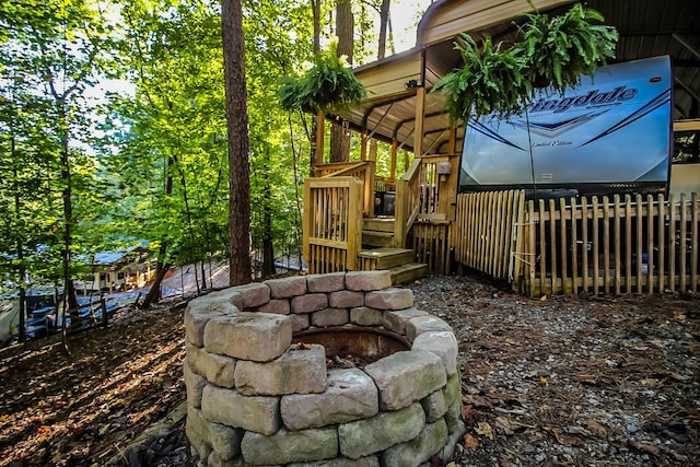 view of yard featuring an outdoor fire pit