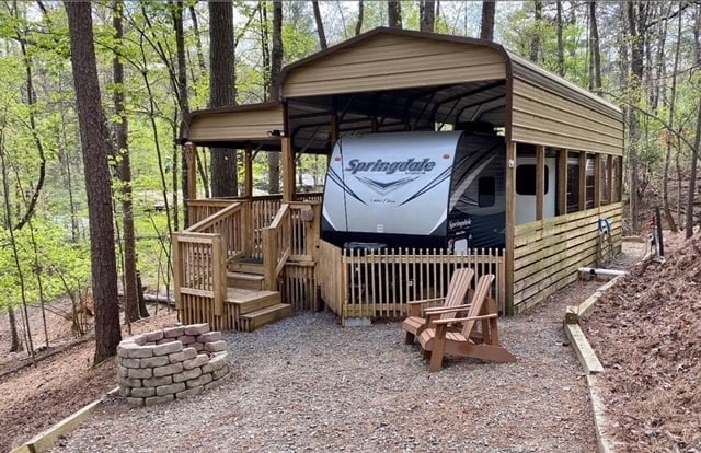 view of outbuilding with a carport