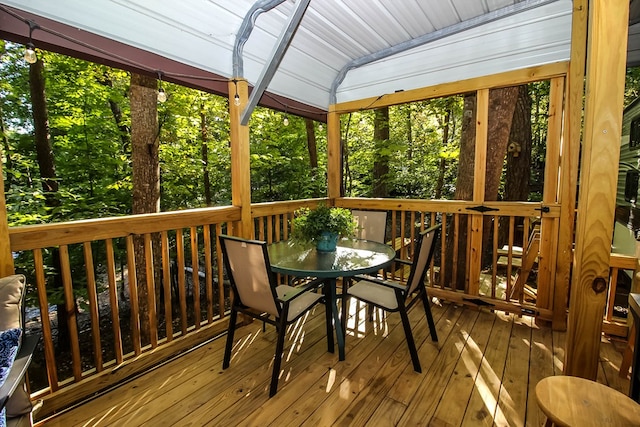 sunroom / solarium with vaulted ceiling