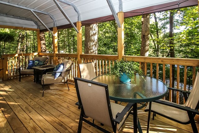 wooden terrace featuring a gazebo