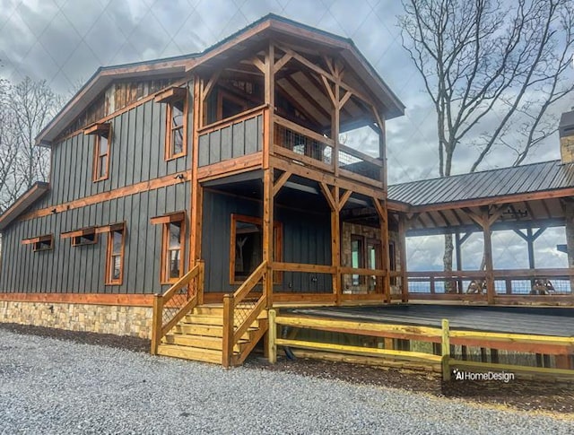 LOT1 S Aska Rd, Blue Ridge, GA 30515 - view of front facade with board and batten siding, a balcony, metal roof, and a chimney