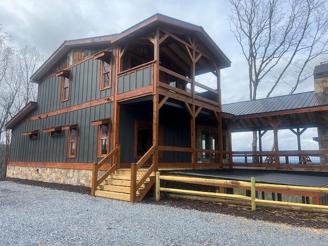 LOT1 S Aska Rd, Blue Ridge, GA 30515 - view of front facade featuring a balcony, board and batten siding, metal roof, and a chimney