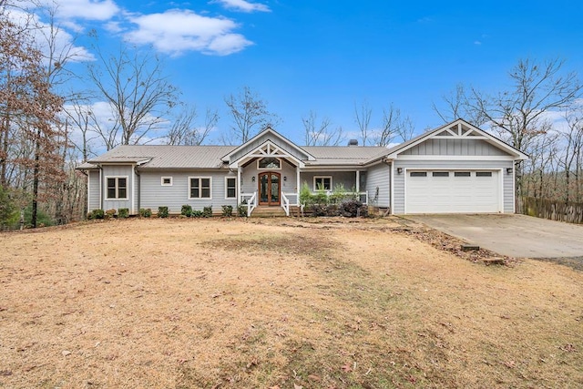 ranch-style house featuring french doors and a garage