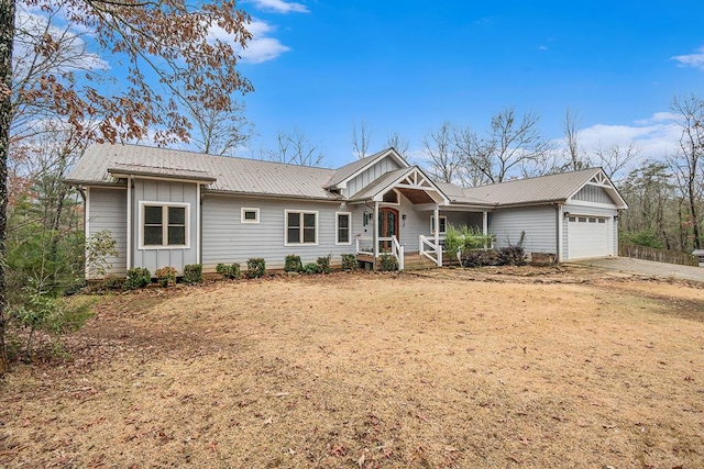 ranch-style house featuring a porch and a garage