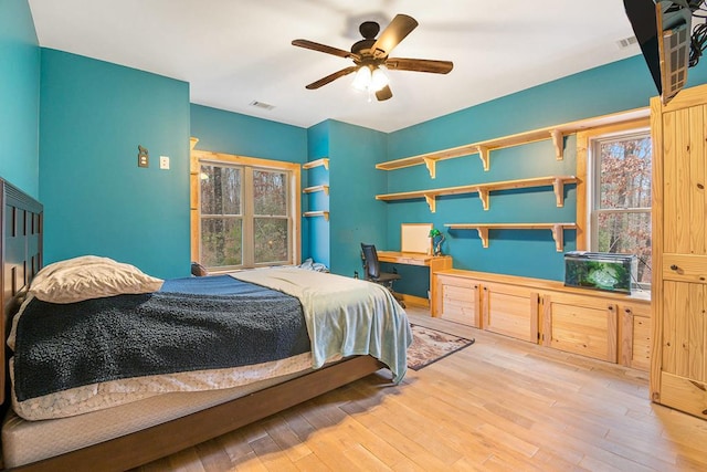 bedroom featuring ceiling fan and wood-type flooring