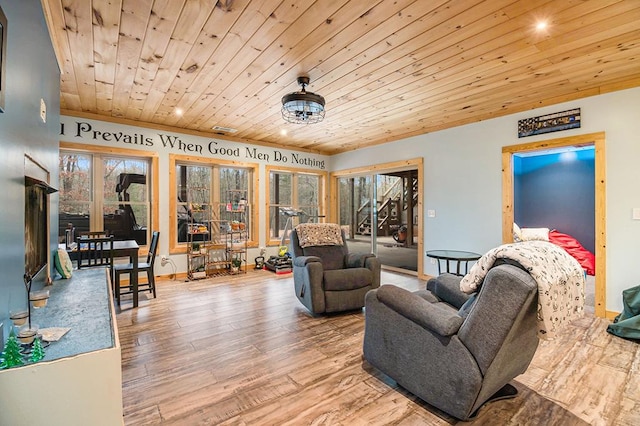 living room featuring light hardwood / wood-style floors and wood ceiling