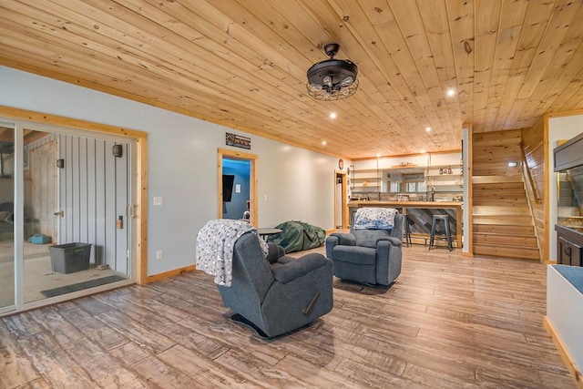 living room featuring wooden walls, wooden ceiling, and hardwood / wood-style flooring