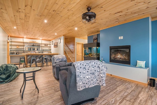 living room with hardwood / wood-style flooring and wooden ceiling