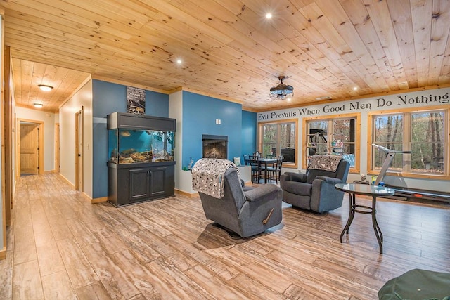 living room featuring a healthy amount of sunlight, wooden ceiling, and light hardwood / wood-style flooring