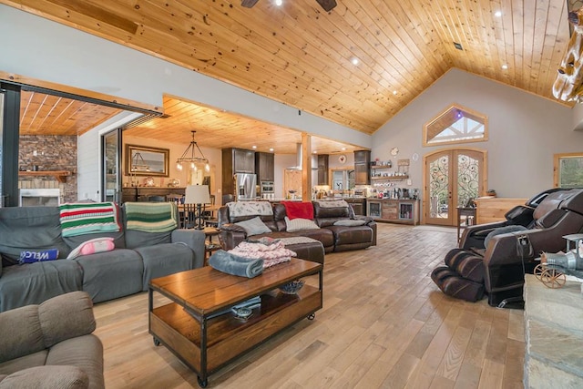 living room featuring french doors, high vaulted ceiling, light hardwood / wood-style floors, wood ceiling, and ceiling fan with notable chandelier