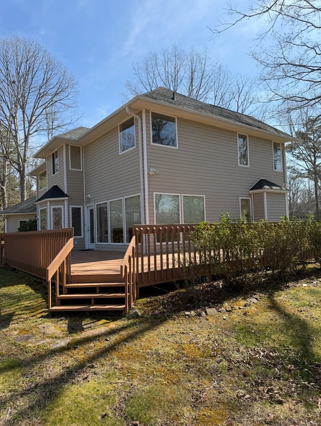 back of house featuring a wooden deck