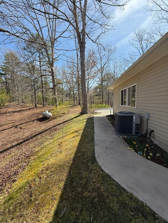 view of yard with central AC unit