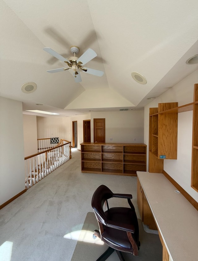 office with baseboards, lofted ceiling, a ceiling fan, and carpet