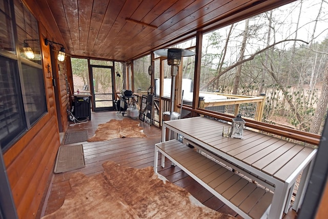 sunroom / solarium with wood ceiling