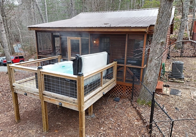 wooden terrace featuring central AC unit