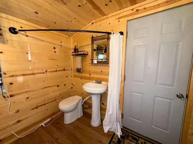 bathroom featuring toilet, wood walls, a shower with curtain, wooden ceiling, and wood-type flooring