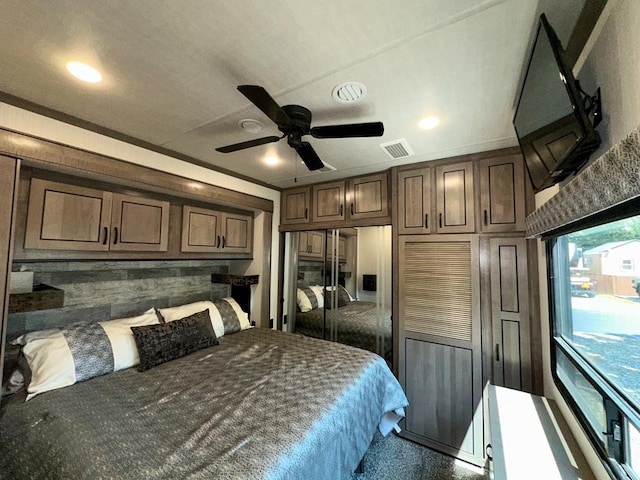 bedroom featuring ceiling fan, a closet, and crown molding