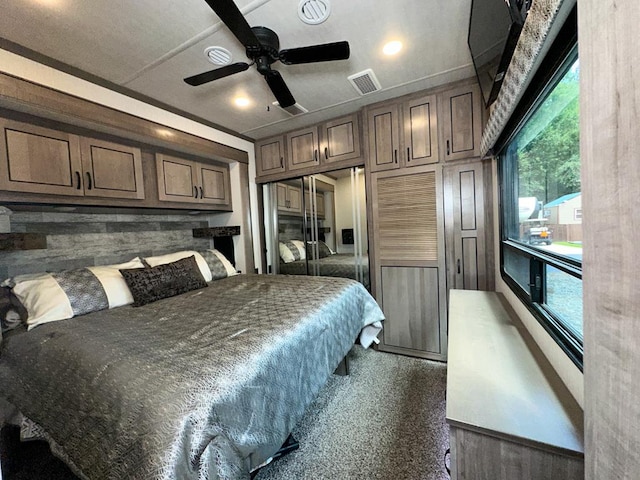 bedroom featuring ceiling fan, a closet, and crown molding