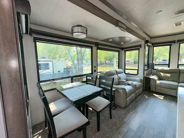 sunroom / solarium featuring plenty of natural light