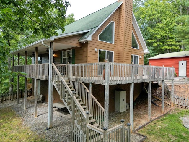 back of house featuring a deck