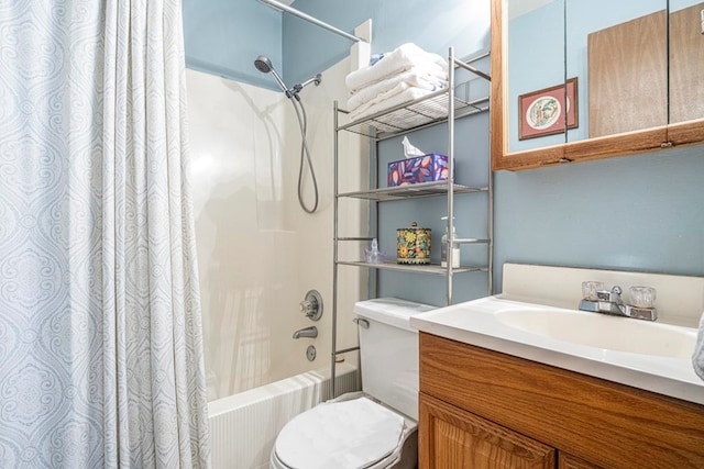 full bathroom featuring shower / bath combo, vanity, and toilet