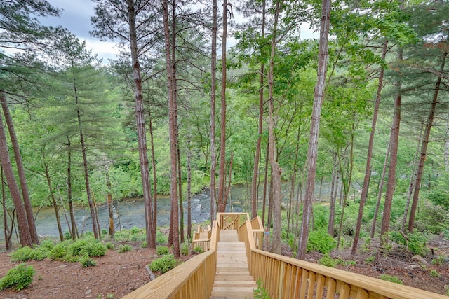 view of home's community featuring a wooded view