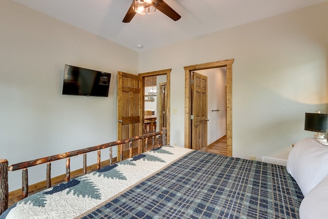 bedroom featuring baseboards, visible vents, and a ceiling fan