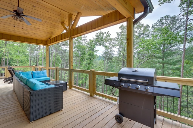 deck with ceiling fan, area for grilling, and an outdoor hangout area