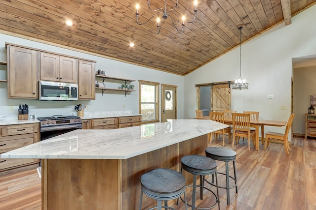 kitchen with a barn door, wooden ceiling, vaulted ceiling, appliances with stainless steel finishes, and open shelves