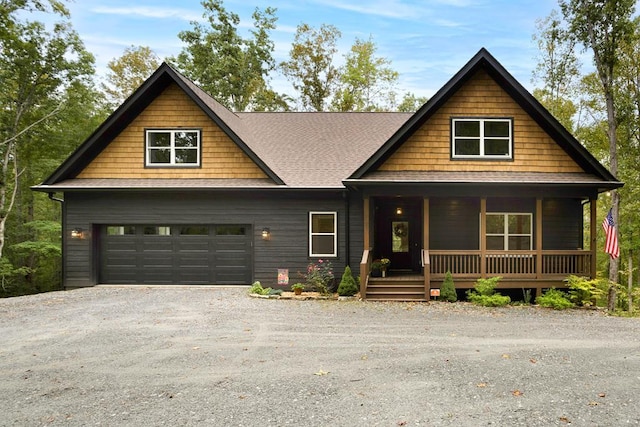 view of front of property featuring a garage and a porch