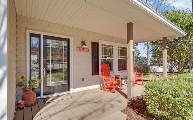 doorway to property featuring a porch