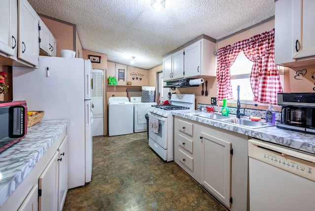 kitchen featuring white cabinets, white appliances, sink, and washing machine and clothes dryer