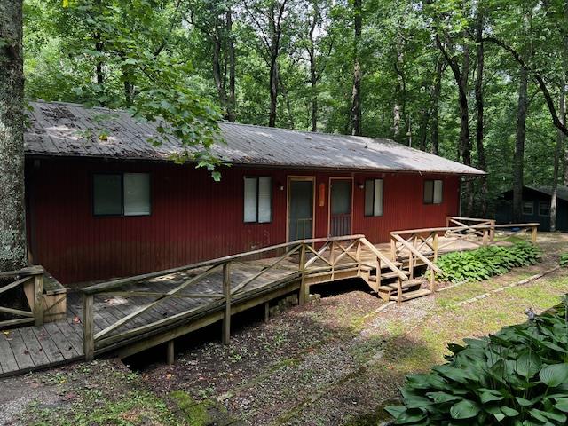 back of house featuring a deck