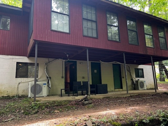 back of house with ac unit and a patio area