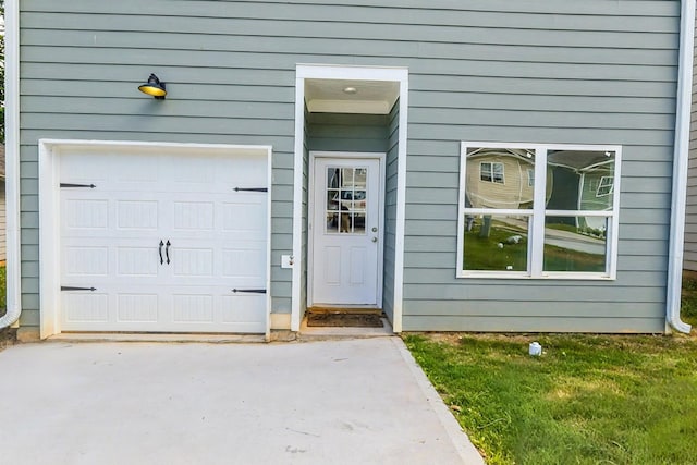 65 Hood Park Ct, Jasper, GA 30143 - view of exterior entry with a garage